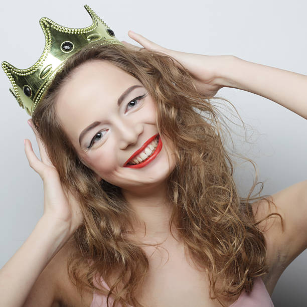 istock young blond woman in crown 2251776275