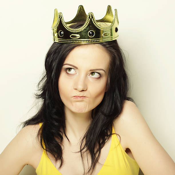 istock young lovely woman with crown 2251776478
