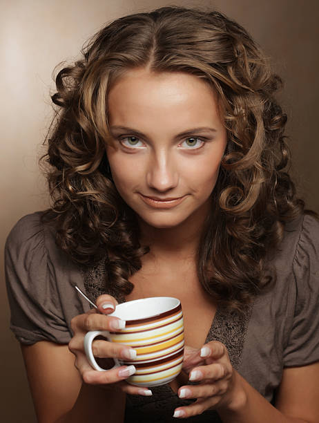 istock young  woman drinking coffee 2251776502