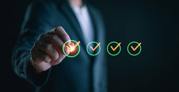 istock Quality check, Businessman makes a checklist Assessment and questionnaire, businessman using smartphone to do online survey, online digital form check mark Choose the correct answer on the exam. 2251777905