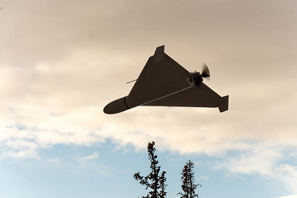 istock A military drone with a propeller is moving in the evening sky. 2251779277