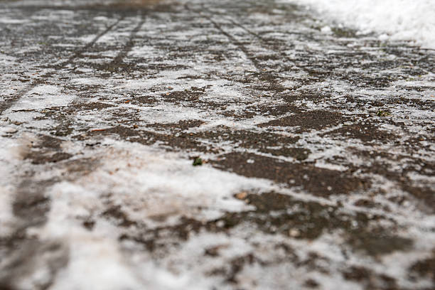 istock Icy Winter Layer Covering Outdoor Brick Walkway Surface 2251780535