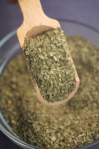 istock Wooden Scoop Filled With Dried Herbal Leaves in a Rustic Setting 2251781129