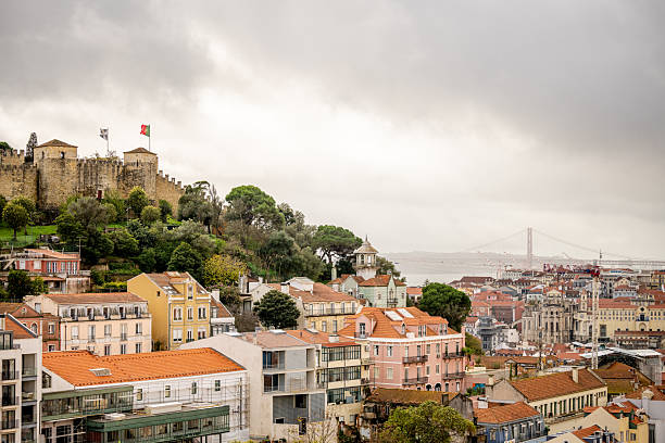 Lisbon Portugal December 05 2025. A hillside of residential buildings is visible with a concrete foreground wall.