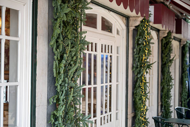 istock Festive garlands and lights decorating a storefront entrance 2251782283