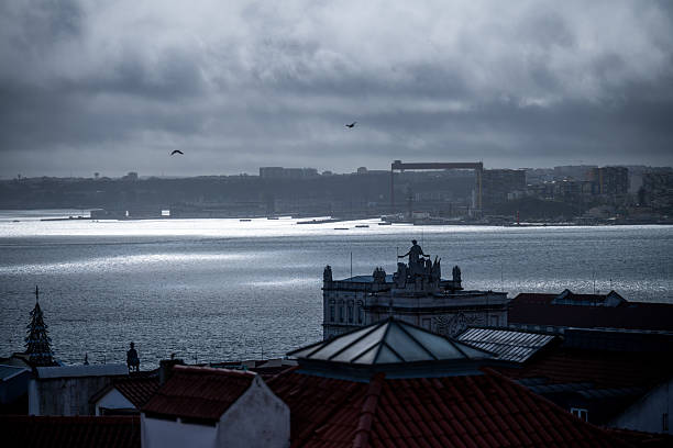 Lisbon Portugal December 05 2025. Overcast light covers the Tagus River and historic rooftops in central Lisbon.