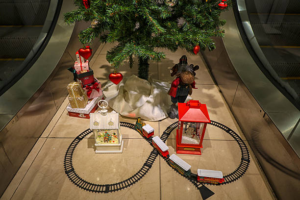 istock Escalator Christmas tree, gifts, celebration, shopping, tradition 2251782680