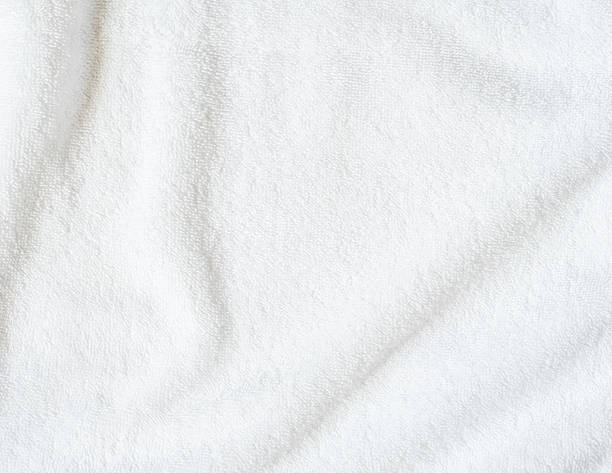 istock White towel texture background or beach bath fabric, kitchen wiper towel or plain blank cloth bathroom rug made of soft clean cotton fiber material for linen laundry backdrop 2251785298