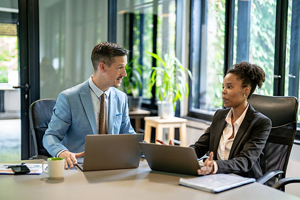 istock Business professionals discussing strategy in modern office 2251785339