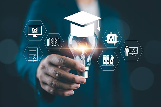 istock Innovative education concept with A person holding light bulb and graduation cap icon, representing e-learning, digital skills, AI knowledge and future learning in modern technology environment. 2251786933