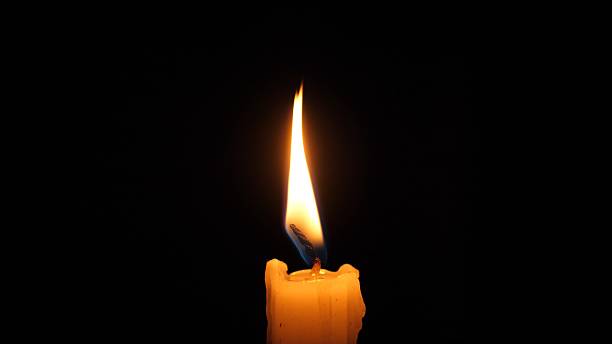 Quiet Candlelight Glow, Flickering Flame In Dark Ambiance, Soft Wax Drips Shape Gentle Glow, Solitary Candle Offers Calming Glow Conducive To Meditation And Remembrance