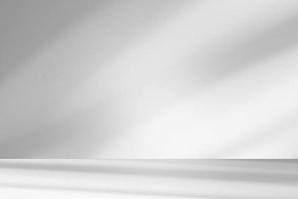 istock Wall interior background, studio and backdrops show products.with shadow from window color white . background for text insertion and presentation product 2251794810