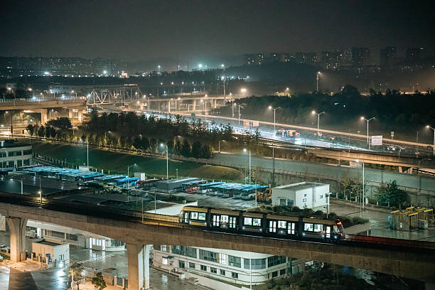 istock Night view of elevated train and busy highway intersections 2251797280