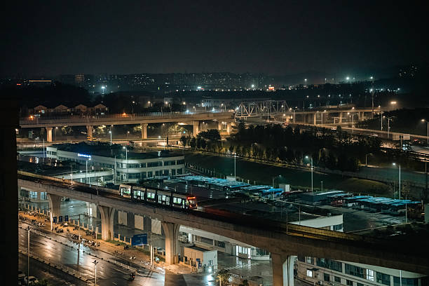 Night view of urban transportation infrastructure with elevated trains