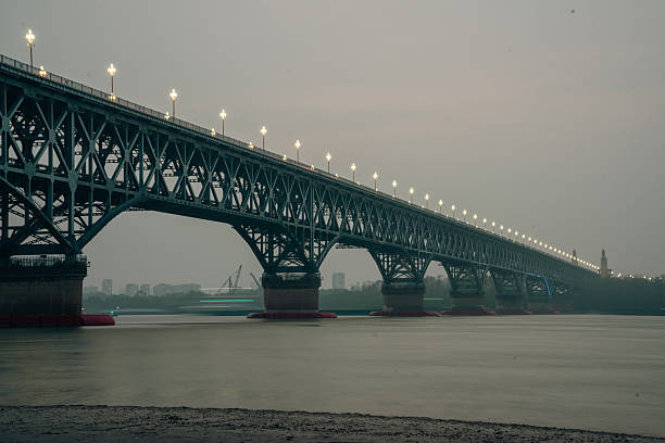 View of the Wuhan Yangtze Great Bridge, a historic double-deck road and rail bridge across the Yangtze River. The bridge extends 1.6 kilometers from Turtle Hill in Hanyang, on the northern bank of the Yangtze, to Snake Hill in Wuchang, on the southern bank of the Yangtze.