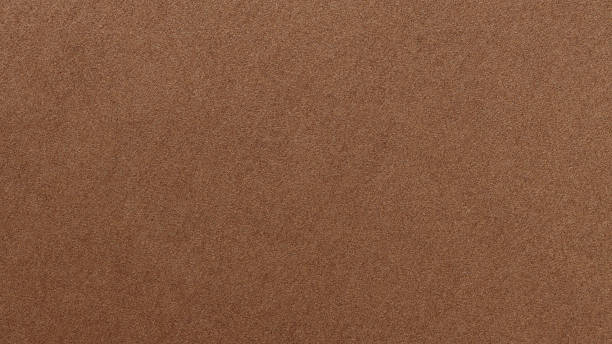 istock Craft Paper Surface with Grainy Texture and Earth Color Macro View 2251798578