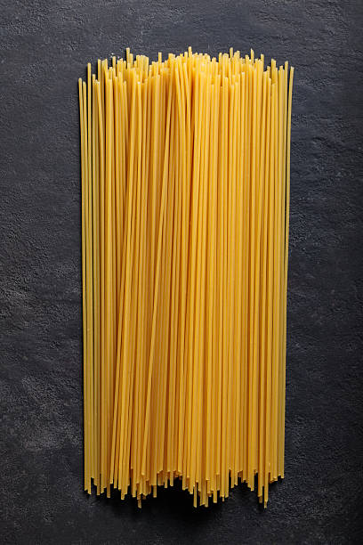 Dry Spaghetti Pasta on Dark Background Close-Up