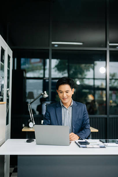 istock Man freelancer is working her job on computer tablet and laptop Doing accounting analysis report real estate 2251801222