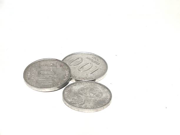 istock Three Indonesian rupiah coins rest on a white surface, showcasing their metallic texture and national emblem—simple, classic, and rich in local currency heritage. 2251801961