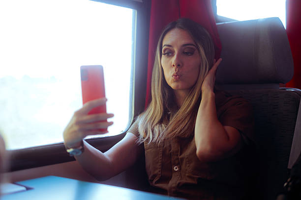 istock Funny Woman Taking Selfies in a Train Journey 2251803895