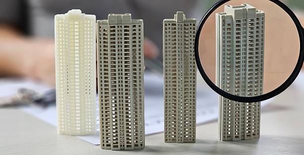 istock Detailed miniature building models showcased on a workspace during a design presentation concept 2251806438