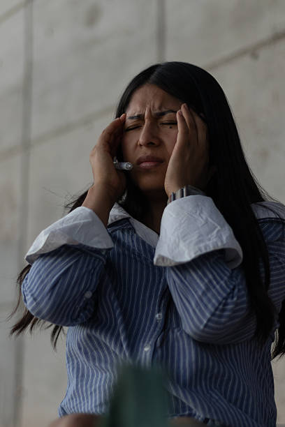 istock Young woman experiencing intense headache, feeling stress and discomfort, hands pressing temples, suffering from migraine symptoms or pressure due to overwork and exhaustion 2251813890