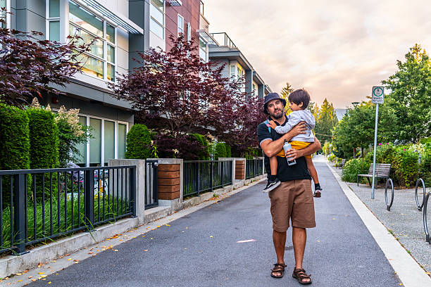 istock Father carrying his son while walking in vancouver city 2251819242