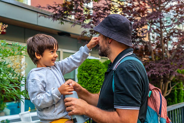 istock Father and son sharing a playful moment outdoors in vancouver 2251819247