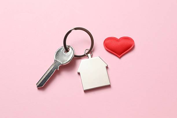 istock Beautiful red heart and key on pink background 2251819933
