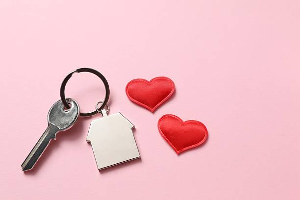 istock Beautiful red heart and key on pink background 2251819948