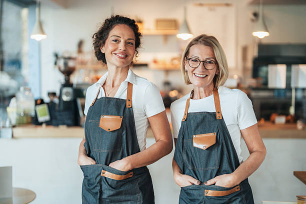 istock Confident coffee shop and bakery owners standing together 2251820181