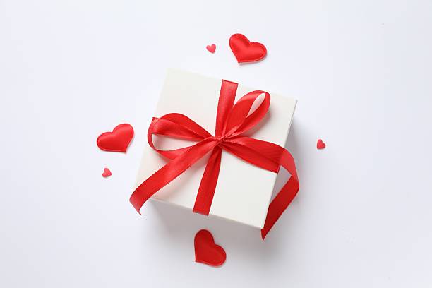 istock Gift box with red hearts on white background 2251820230