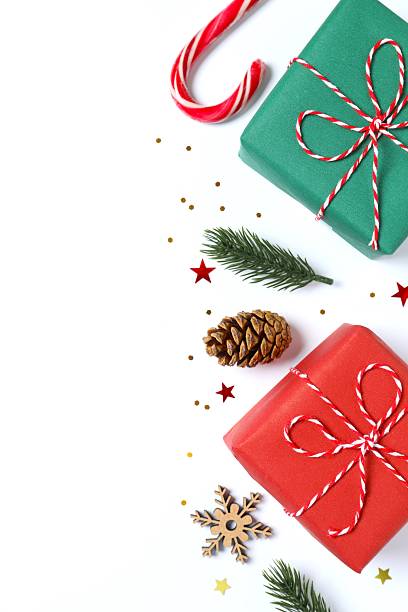 istock Christmas gift boxes and decorations on white background,  seasonal greeting 2251820701
