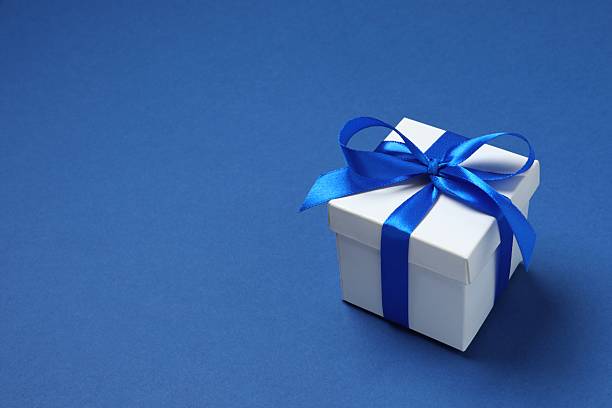 istock Festive gift box on color background 2251821298