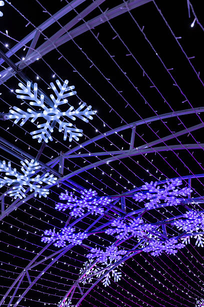 istock Snowflake light tunnel illuminating a festive winter night 2251821310