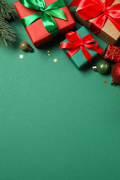 istock Christmas gift boxes and decorations on color background,  seasonal greeting 2251821508