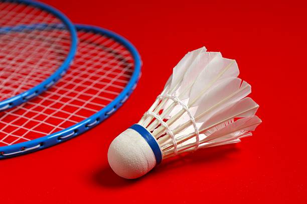 istock Badminton rackets and white badminton shuttlecock on color background 2251821629