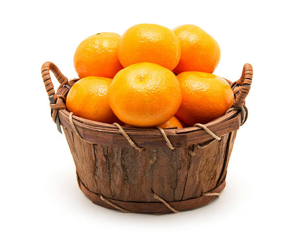 istock Mandarin in basket isolated on white 2251822188