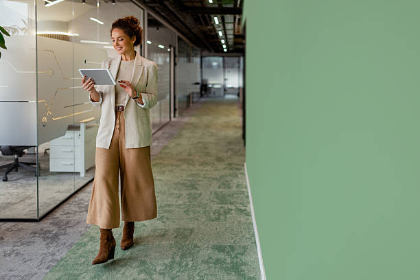 istock Businesswoman Using Digital Tablet in Stylish Workplace 2251824412