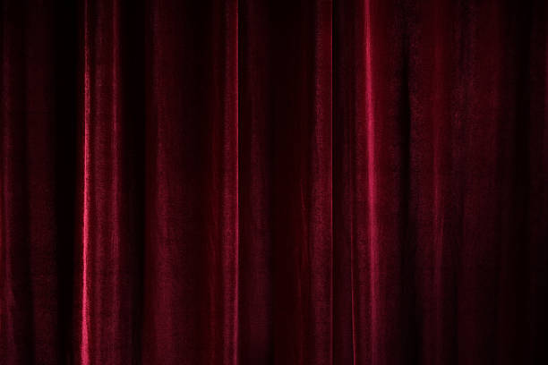 istock Dark red velvet curtain, full frame background texture, concept for theater, performances, and festive events, copy space 2251828867