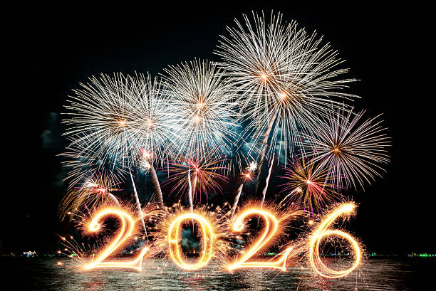 istock Sparkler 2026 text colorful firework illumination on dark blue sky background, happy new year 2026 concept 2251829791