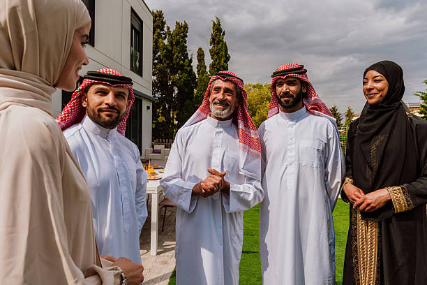 istock Arab multi-generational family gathering and discussing outdoors 2251831141