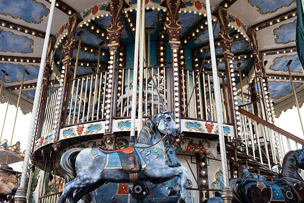 Mother and her baby boy enjoying a vintage carousel ride at an amusement park, bonding and creating cherished childhood memories in a festive and joyful moment