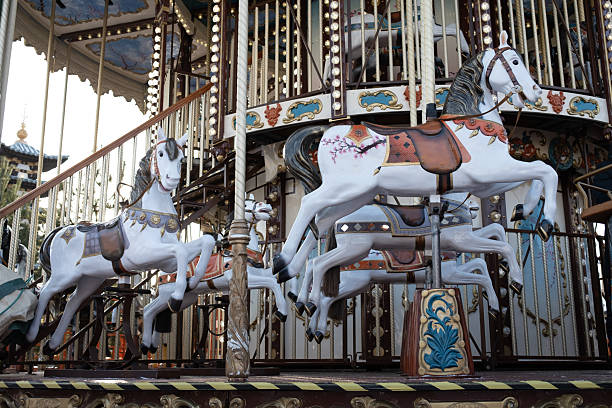 istock Magical vintage merry-go-round with white horses 2251831187
