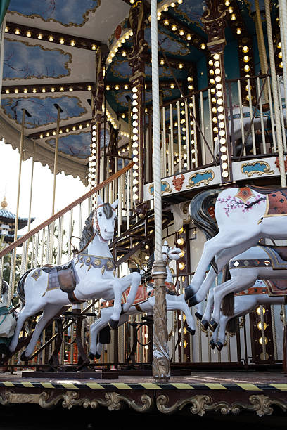 istock Magical vintage merry-go-round with white horses 2251831191