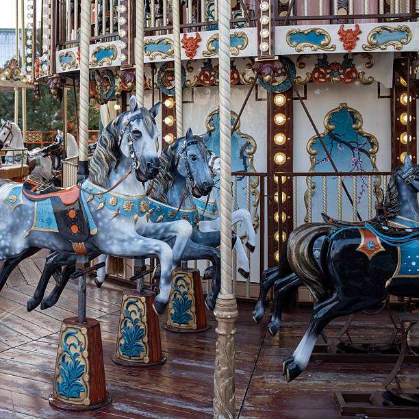 istock Classic Dapple Grey Horses on a Fairground Carousel 2251831208