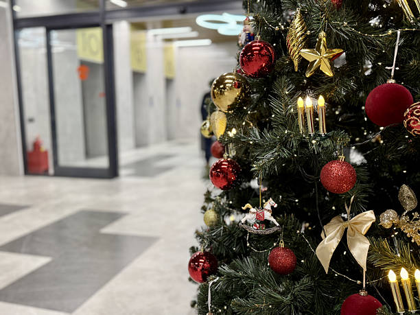 istock Holiday Tree At Transit Hub, Seasonal Display With Illuminated Christmas Tree, Christmas Themed Ornamentation With Sparkling Lights And Reflective Surfaces In Transit Environment 2251831380