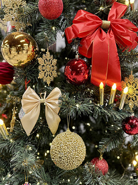 istock Festive Christmas Tree Ornaments Glowing Candles, Red And Gold Baubles, Glass Star, Nutcracker Figurine, Delicate Tinsel And Garland, Warm Bokeh Lights And Candlelight, Lush Pine Branches 2251832921