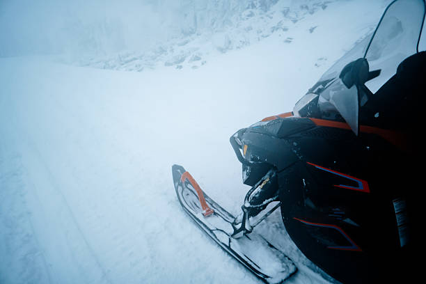 man on snowmobile in the bighorn mountains, wyoming
