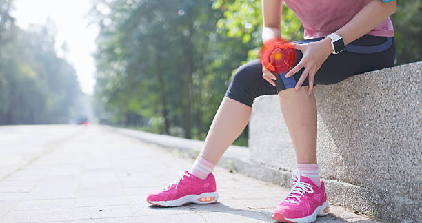 istock female running knee pain 2251834771